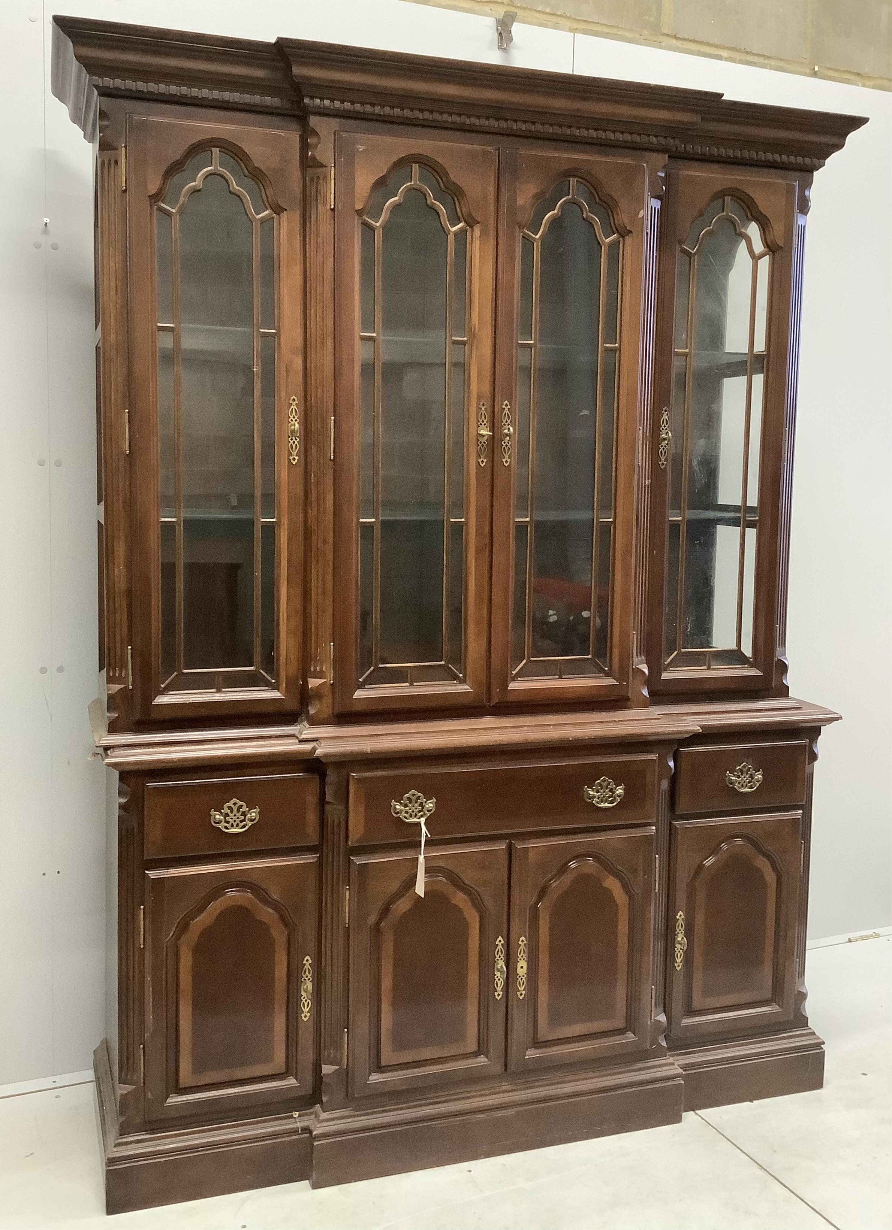 A Victorian style mahogany break front display cabinet, width 151cm, depth 43cm, height 202cm. Condition - poor to fair